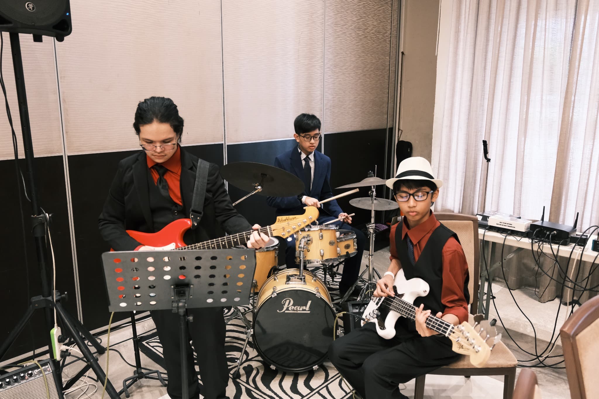 Students at Leaders performing together in a school band.