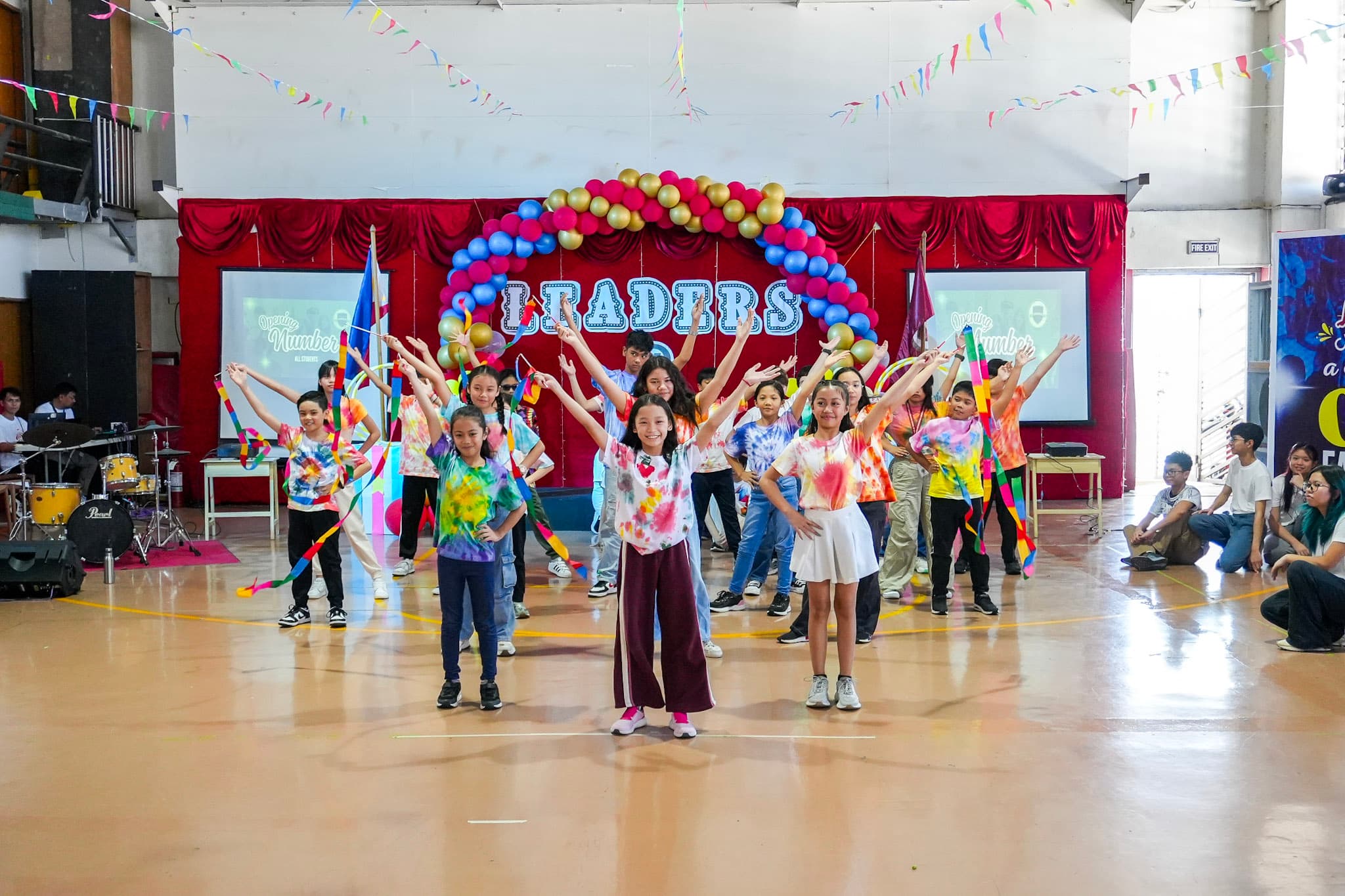 Students at Leaders performing together during a school celebration.