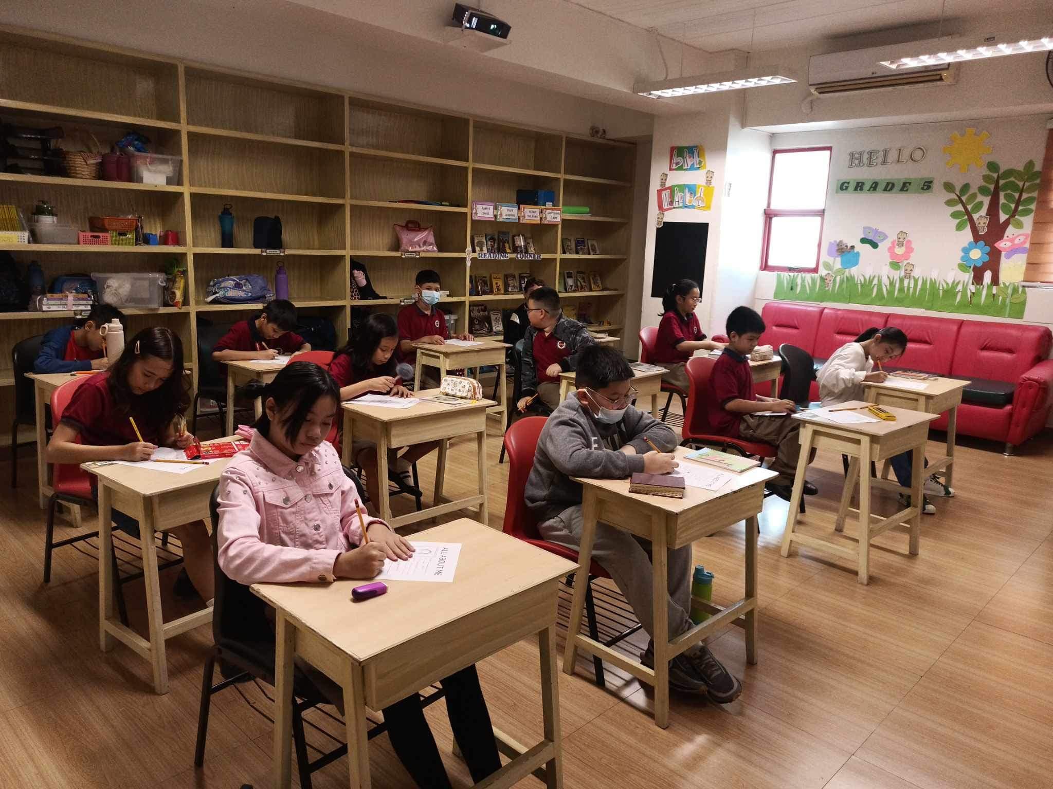 Students at Leaders learning in a small classroom setting.